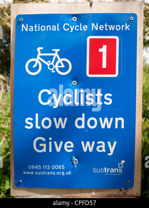 National Cycle Network Sign warning cyclists to slow down and give way (to pedestrians). Stock Photo