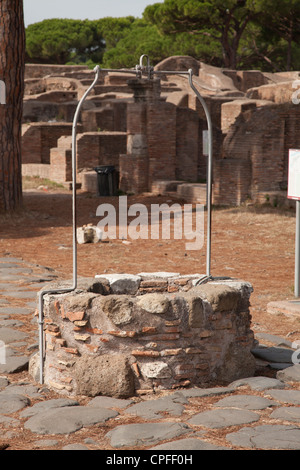 Well on the Decumanus at The ancient roman port town ruin of Ostia near Rome Stock Photo