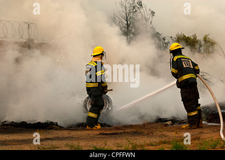 Johannesburg firefighters battling a local fire blaze in the afternoon ...