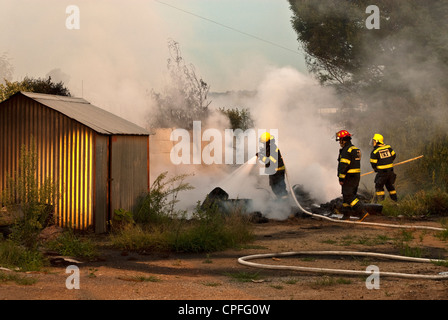 Johannesburg firefighters battling a local fire blaze in the afternoon ...