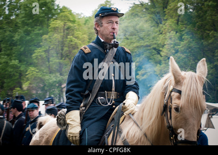 A Union Army  officer with pipe sitting on the warhorse, Civil War reenactment, Bensalem, Pennsylvania, USA Stock Photo