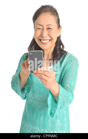 Senior woman using smartphone Stock Photo