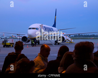 Passengers waiting to board a Ryanair airplane Stock Photo