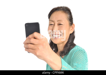 Senior woman using smartphone Stock Photo
