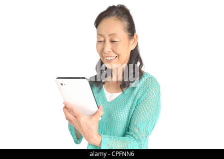 Senior woman using tablet computer Stock Photo
