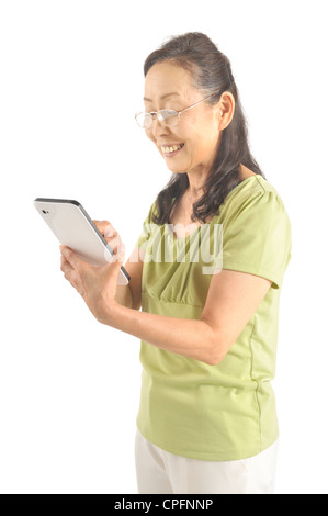 Senior woman using tablet computer Stock Photo