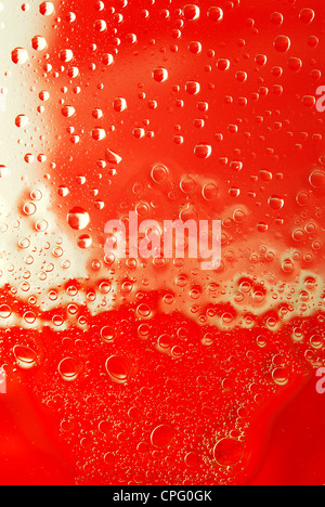 Water drops glass red bright background Stock Photo - Alamy