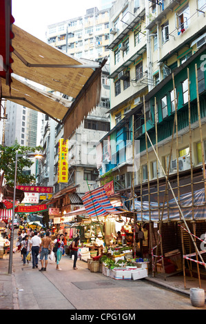 Street vendors at an outdoor wet market in Central Hong Kong, China. September 2011. Stock Photo