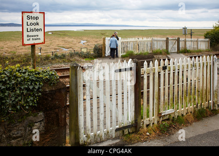 An unmanned railway crossing at Grange over Sands, Cumbria Stock Photo