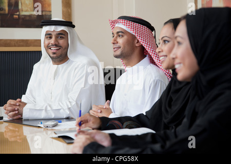 Arab business people in meeting, portrait of man smiling. Stock Photo