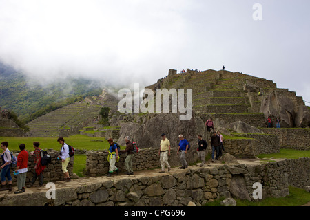 Tourists at Machu Picchu, Peru, South America The lost city of the Inca Stock Photo