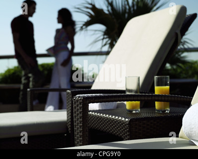 Young couple beside the pool. Stock Photo