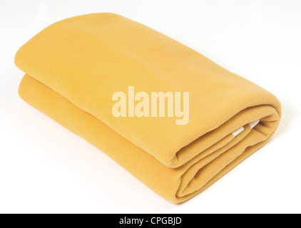 Yellow blanket against a white background Stock Photo