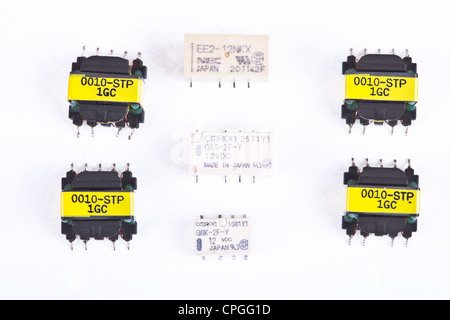SMT / SMD relays and transformers used to assembly PCB's printed circuit in the electronics industry, electronics devises. Stock Photo