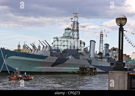 HMS Belfast Royal Navy 1930's light cruiser now a museum ship moored on river Thames London England Europe Stock Photo