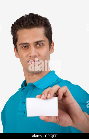 Man holding a small blank card. Stock Photo