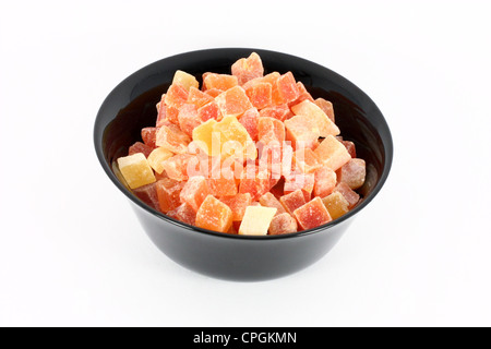 Black bowl full of dried papaya Stock Photo