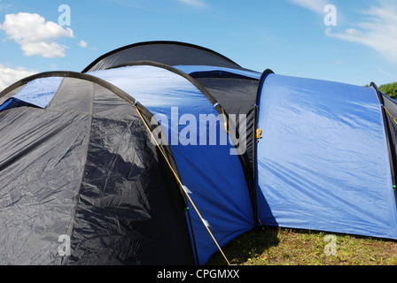 blue and black big tent on green grass Stock Photo