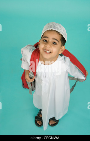 Boy (8-9) wearing shoulder bag, elevated view, portrait Stock Photo