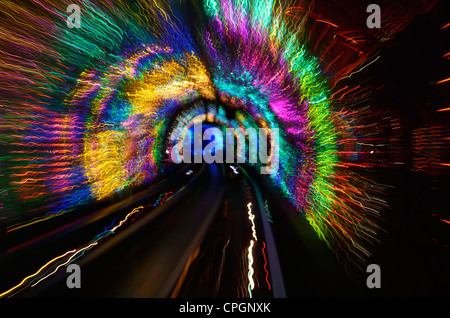 Streaking multicolored lights and rails of the Bund Sightseeing Tunnel under the Huangpu River Shanghai China Stock Photo