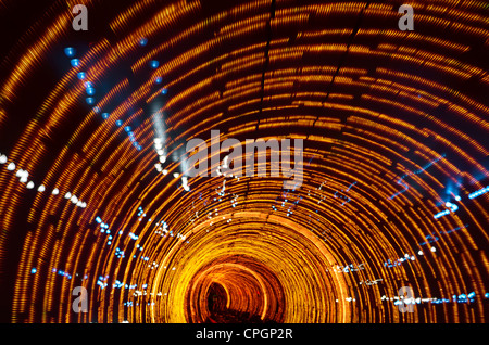 Psychedelic orange lights in the Bund Sightseeing Tunnel under the Huangpu River Shanghai China Stock Photo