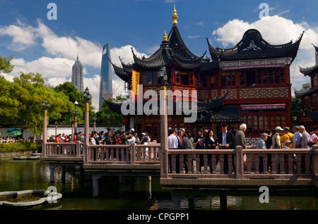 Crowds of tourists on the nine Zigzag bridge at the famous Huxinting Teahouse midlake pavilion Shanghai Peoples Republic of China Stock Photo