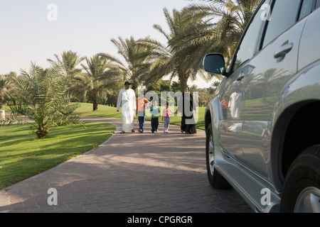 Father and mother with children at park Stock Photo