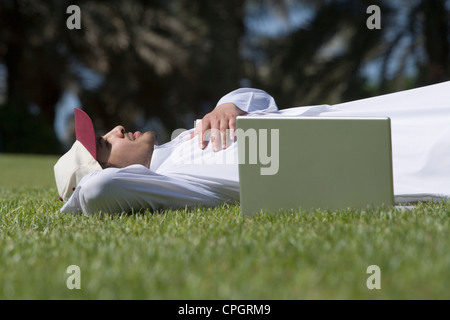 Young man lying on grass Stock Photo
