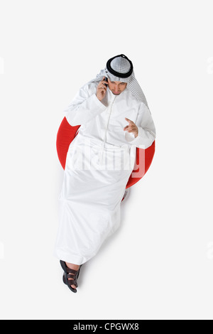 Young man on the phone, elevated view Stock Photo