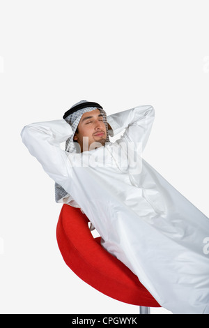 Young man sleeping on chair Stock Photo