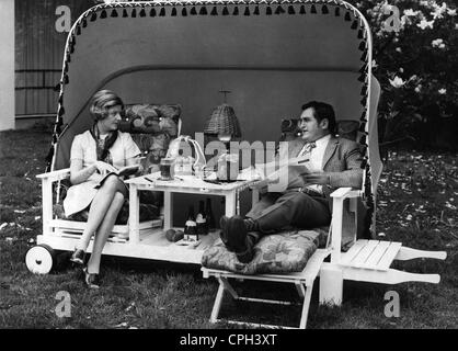 leisure time, woman and man reading in a ' Hawaii Arbour', made by Modellbau Oswald Brunn, Munich, presented at a home maker's fair in Frankfurt on the Main, 1960s, Additional-Rights-Clearences-Not Available Stock Photo