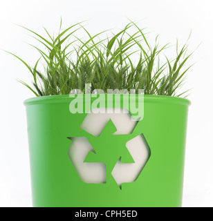 A recycling trash bin with growing grass Stock Photo