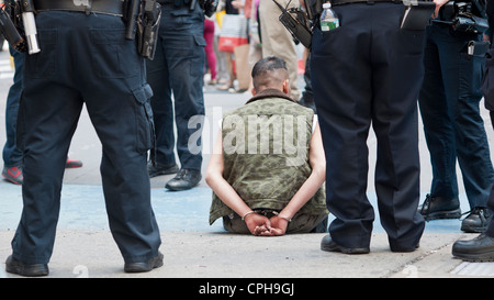 NYPD surround an arrestee for disorderly conduct in Times Square in New York on Friday, May 18, 2012. (© Richard B. Levine) Stock Photo