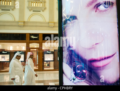 Advertising billboard in upmarket modern Villagio Mall in Doha Qatar Stock Photo