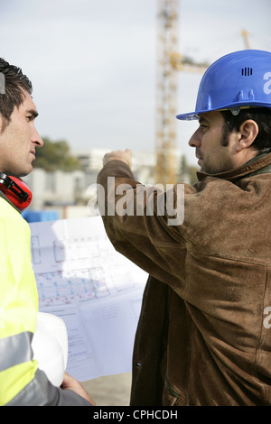 Workers on a construction site Stock Photo