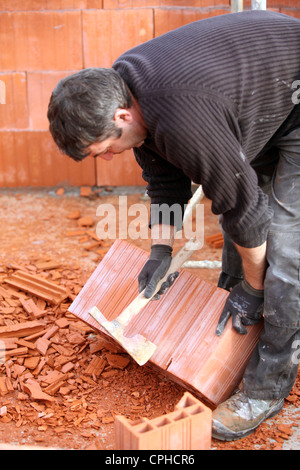 Mason on construction site Stock Photo