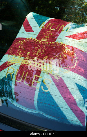 Union Jack flag 'mum rules' crown cushion in back of a car Stock Photo