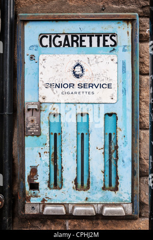 1960s cigarette vending machine 70's Era Vintage and rows of brass pull knobs with original brand labels intact Cigarette machine 1960s hi-res stock