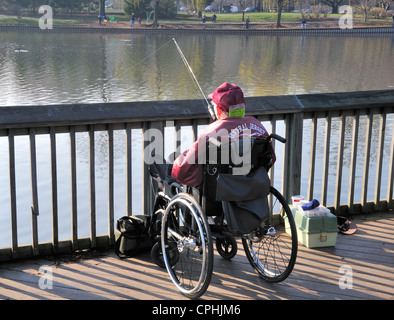 Man in wheelchair fishing on opening day of trout season, New Jersey, 2011 Stock Photo