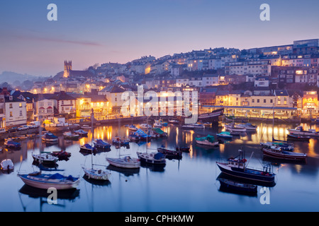 Overlooking Brixham harbour at dusk, Devon England UK Stock Photo