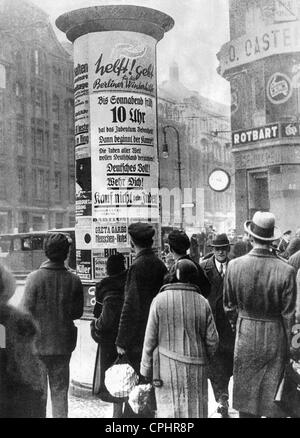 Anti-semitic posters on an advertising column in Berlin, 1933 (b/w photo) Stock Photo