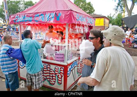 People buying cotton candy in an artistic concession booth.  Minnesota State Fair St Paul Minnesota MN USA Stock Photo