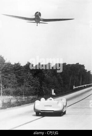 Bernd Rosemeyer in a race with an airplane, 1937 Stock Photo