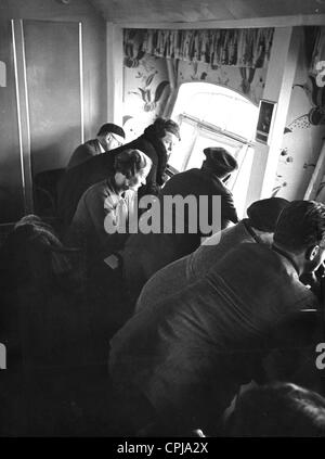 Passengers in the gondola of the airship LZ 127 ' Graf Zeppelin' enjoy the view Stock Photo