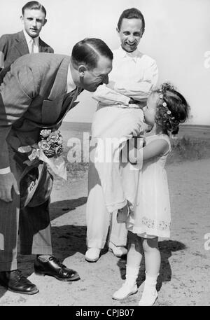 Adolf Hitler and Joseph Goebbels with daughter Helga Goebbels, 1935 Stock Photo