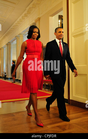 US President Barack Obama and first lady Michelle Obama walk to a Medal of Honor award ceremony in honor of Leslie H. Sabo Jr., at the White House May 16, 2012 in Washington, DC Stock Photo