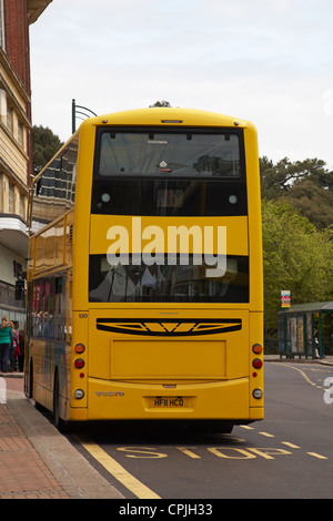 Yellow Buses bus stopped at bus stop in Bournemouth Town Centre in May Stock Photo