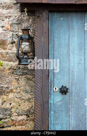 Door and oil lamp in Brixham, Devon, England Stock Photo