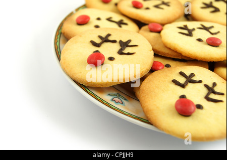 Christmas reindeer cookies on plate isolated on white Stock Photo