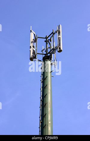 Mobile phone mast against a blue sky Stock Photo